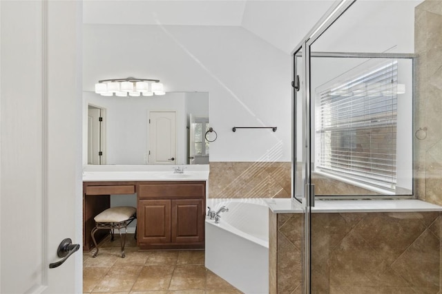 250 Maeves Way, Austin, TX 78737 - full bathroom with vanity, a garden tub, tile patterned flooring, a stall shower, and lofted ceiling