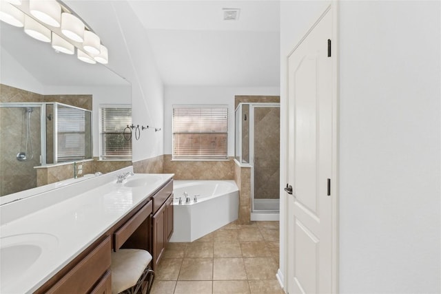 250 Maeves Way, Austin, TX 78737 - bathroom with a stall shower, a bath, double vanity, and tile patterned floors