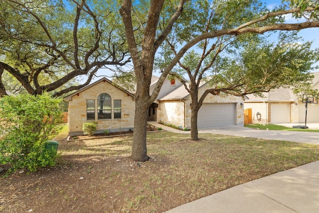 250 Maeves Way, Austin, TX 78737 - view of front of home featuring driveway, an attached garage, and a front lawn