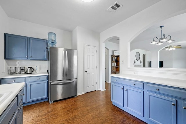 808 N Creek Blvd, Leander, TX 78641 - kitchen featuring freestanding refrigerator, blue cabinets, and light countertops