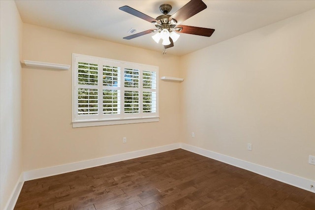 10908 Railway Ln Unit 76, Austin, TX 78717 - spare room with dark wood-style floors, a ceiling fan, and baseboards