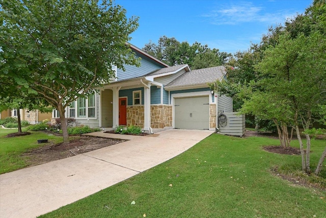 10908 Railway Ln Unit 76, Austin, TX 78717 - view of front of house with an attached garage, concrete driveway, a front yard, and stone siding