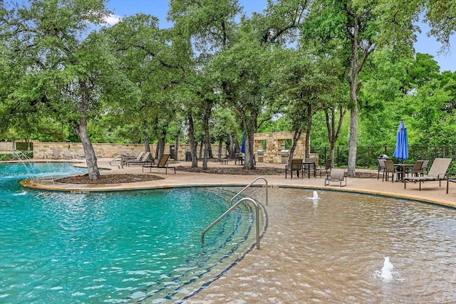 10908 Railway Ln Unit 76, Austin, TX 78717 - community pool featuring view of scattered trees and a patio area