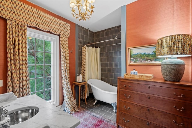 6203 Ledge Mountain Dr, Austin, TX 78731 - full bathroom featuring a freestanding tub, a chandelier, tile patterned floors, tiled shower, and vanity