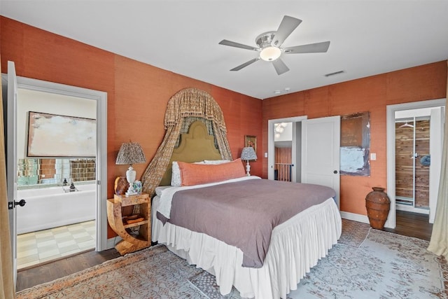 6203 Ledge Mountain Dr, Austin, TX 78731 - bedroom with wood finished floors, ensuite bath, and ceiling fan
