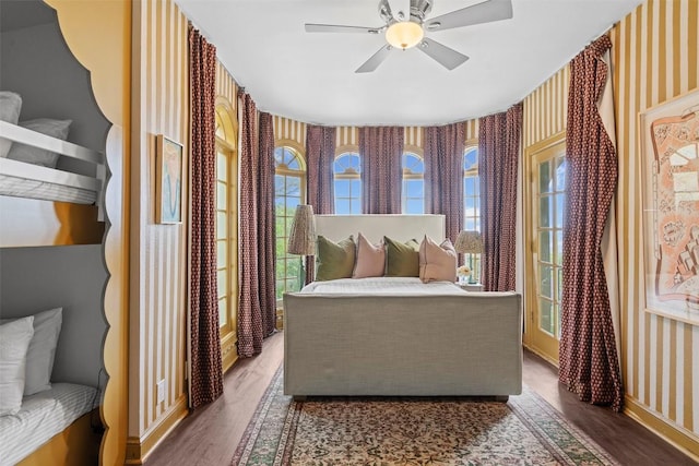 6203 Ledge Mountain Dr, Austin, TX 78731 - bedroom featuring wallpapered walls, wood finished floors, multiple windows, and ceiling fan