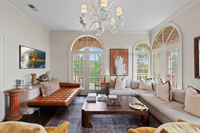 6203 Ledge Mountain Dr, Austin, TX 78731 - living area featuring wood finished floors, healthy amount of natural light, ornamental molding, and a chandelier