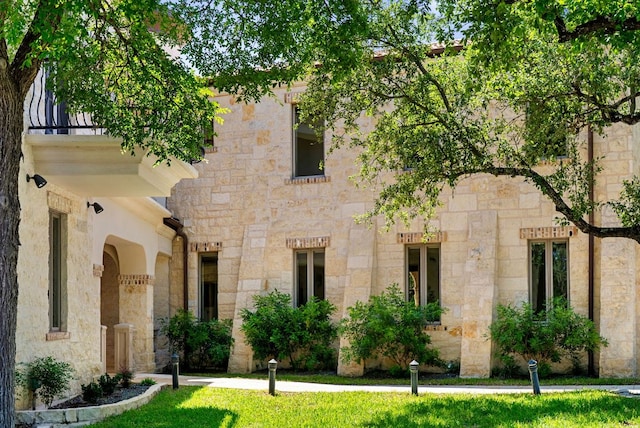 4256 Fischer Store Rd, Wimberley, TX 78676 - view of front of house with stone siding and a front yard