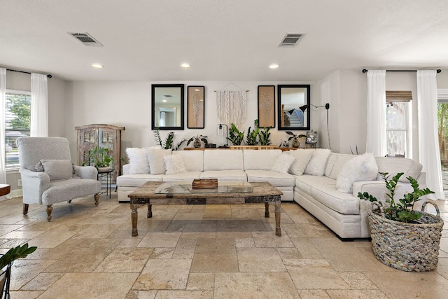1705 Chinati Ct, Cedar Park, TX 78613 - living room featuring stone tile floors, healthy amount of natural light, and recessed lighting