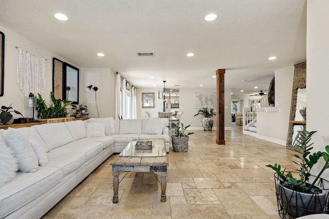1705 Chinati Ct, Cedar Park, TX 78613 - living area featuring stone tile floors, recessed lighting, baseboards, and ornate columns