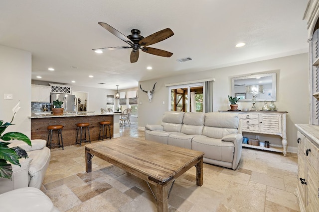 1705 Chinati Ct, Cedar Park, TX 78613 - living room with ceiling fan, stone tile floors, recessed lighting, and baseboards