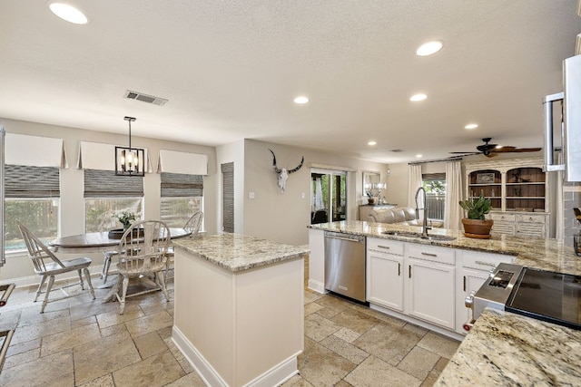 1705 Chinati Ct, Cedar Park, TX 78613 - kitchen with a sink, dishwasher, stone tile flooring, recessed lighting, and range