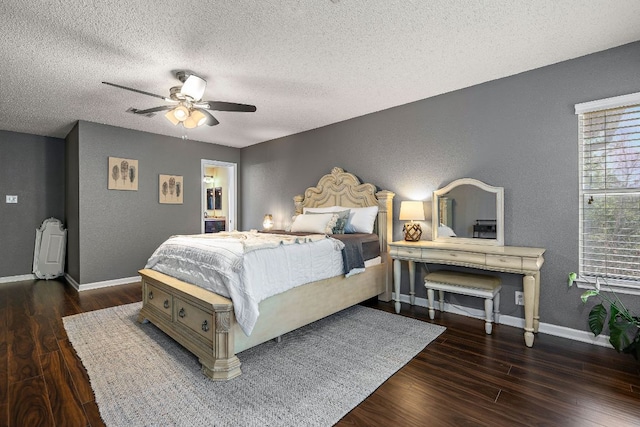 1705 Chinati Ct, Cedar Park, TX 78613 - bedroom featuring a textured wall, wood finished floors, a textured ceiling, baseboards, and ceiling fan