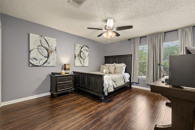1705 Chinati Ct, Cedar Park, TX 78613 - bedroom featuring baseboards, a textured ceiling, dark wood-type flooring, and ceiling fan
