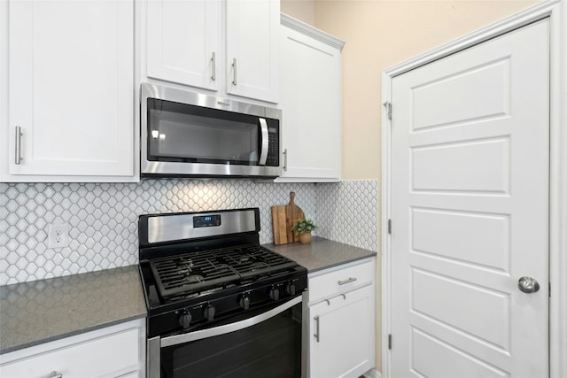 11805 Bracco Dr, Austin, TX 78748 - kitchen featuring stainless steel appliances, white cabinetry, tasteful backsplash, and dark countertops