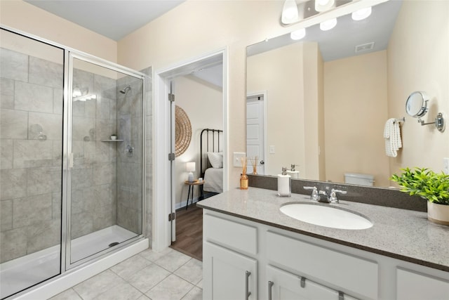 11805 Bracco Dr, Austin, TX 78748 - full bath with tile patterned flooring, vanity, a shower stall, connected bathroom, and toilet