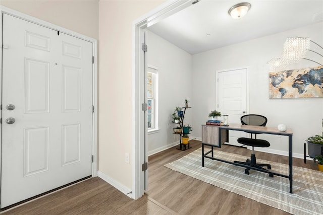11805 Bracco Dr, Austin, TX 78748 - office area with wood finished floors, baseboards, and a chandelier