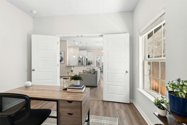 11805 Bracco Dr, Austin, TX 78748 - office area with light wood-style floors and baseboards