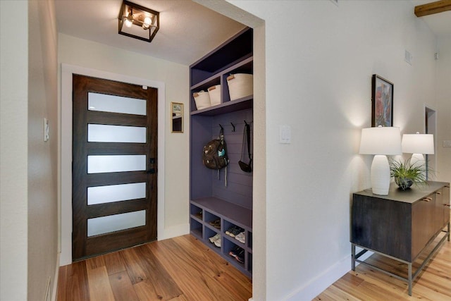12801 Oak Bend Cv, Austin, TX 78727 - mudroom featuring light wood-type flooring and baseboards