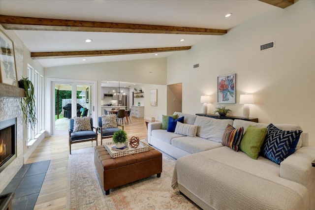 12801 Oak Bend Cv, Austin, TX 78727 - living room featuring a fireplace, light wood finished floors, recessed lighting, and a chandelier