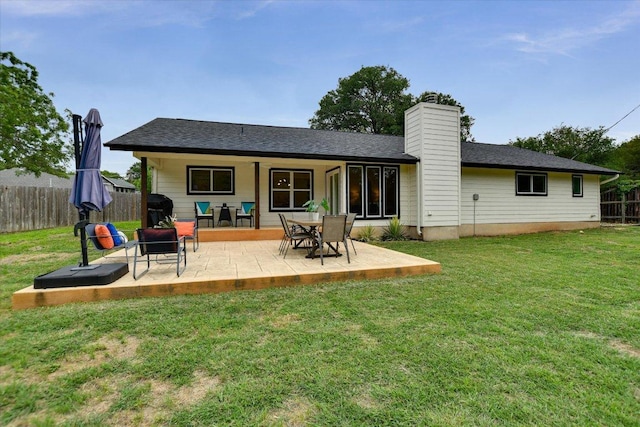 12801 Oak Bend Cv, Austin, TX 78727 - back of house with a patio area and a chimney