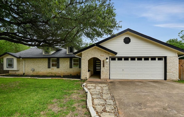12801 Oak Bend Cv, Austin, TX 78727 - view of front of property with stone siding, concrete driveway, and a garage