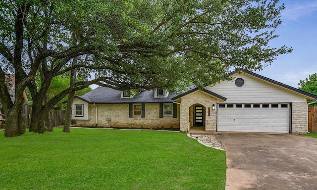 12801 Oak Bend Cv, Austin, TX 78727 - view of front of home with stone siding, driveway, and a garage