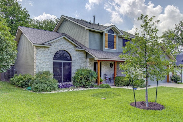 14309 Richard Walker Blvd, Austin, TX 78728 - view of front facade featuring stone siding, a porch, roof with shingles, a front lawn, and driveway