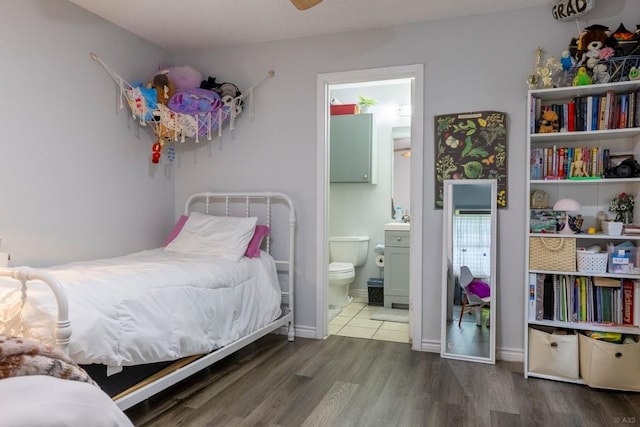 2903 W Slaughter Ln, Austin, TX 78748 - bedroom featuring wood finished floors and connected bathroom