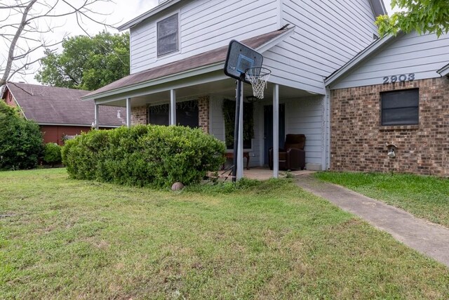 2903 W Slaughter Ln, Austin, TX 78748 - view of front facade featuring brick siding and a front yard
