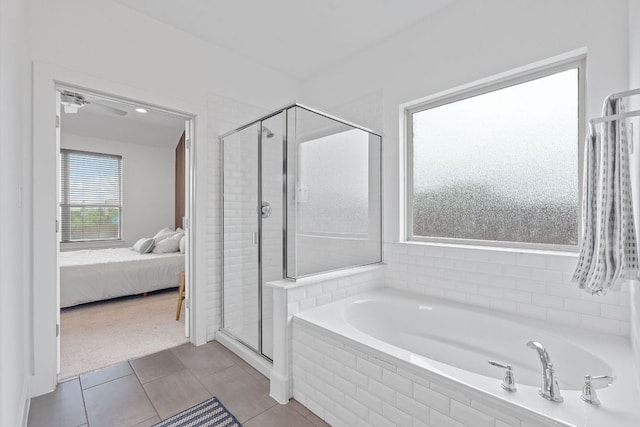104 Meadow Wood Cv, Georgetown, TX 78626 - full bath featuring a shower stall, a garden tub, ensuite bath, and tile patterned flooring