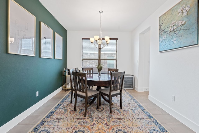 104 Meadow Wood Cv, Georgetown, TX 78626 - tiled dining area with a chandelier and baseboards