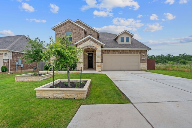 104 Meadow Wood Cv, Georgetown, TX 78626 - view of front of home featuring a front yard, concrete driveway, brick siding, and stone siding