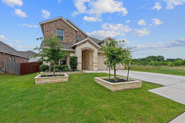 104 Meadow Wood Cv, Georgetown, TX 78626 - view of front of home with concrete driveway, stone siding, and brick siding
