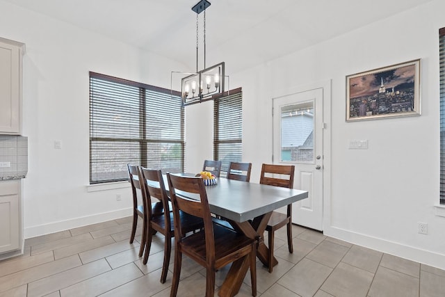 104 Meadow Wood Cv, Georgetown, TX 78626 - dining room featuring a chandelier, baseboards, and light tile patterned floors
