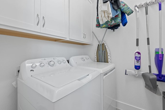 104 Meadow Wood Cv, Georgetown, TX 78626 - washroom with washing machine and dryer and cabinet space