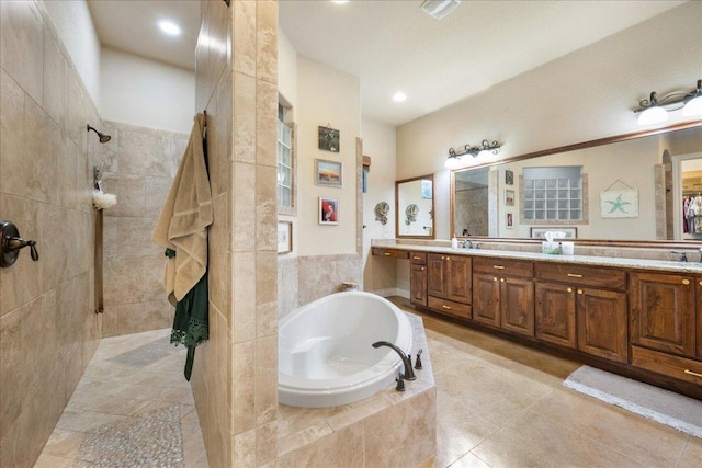102 Standing Oak Dr, Georgetown, TX 78633 - bathroom featuring a garden tub, walk in shower, double vanity, tile patterned flooring, and recessed lighting