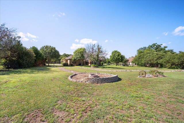 102 Standing Oak Dr, Georgetown, TX 78633 - view of green lawn featuring a fire pit