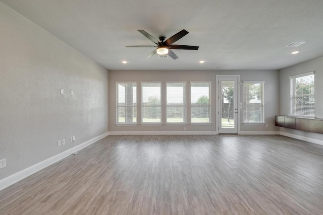 3241 Aurelia Ln, Round Rock, TX 78665 - unfurnished living room featuring baseboards, ceiling fan, wood finished floors, and recessed lighting