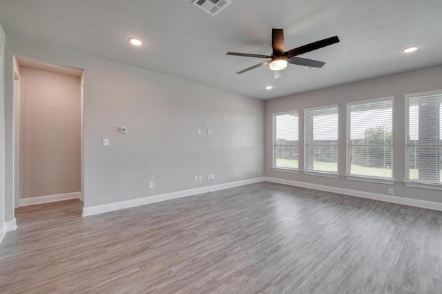 3241 Aurelia Ln, Round Rock, TX 78665 - unfurnished room featuring a ceiling fan, baseboards, wood finished floors, and recessed lighting