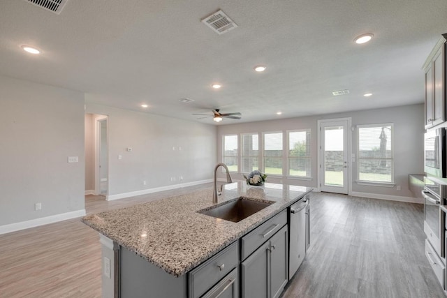 3241 Aurelia Ln, Round Rock, TX 78665 - kitchen with a sink, open floor plan, appliances with stainless steel finishes, a ceiling fan, and recessed lighting