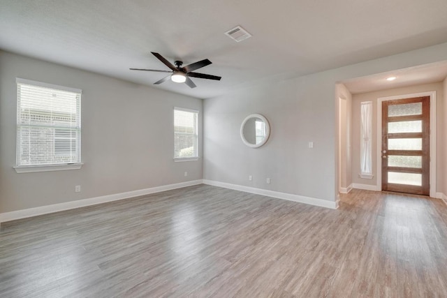 3241 Aurelia Ln, Round Rock, TX 78665 - unfurnished room featuring a ceiling fan, light wood-style floors, and baseboards