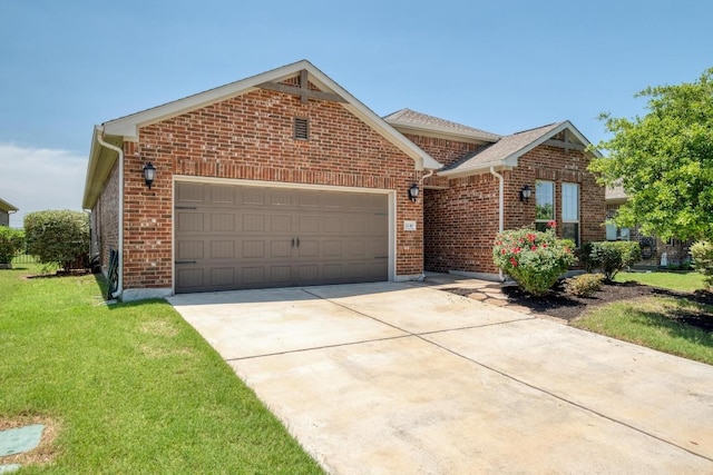 3241 Aurelia Ln, Round Rock, TX 78665 - view of front of house with a garage, driveway, brick siding, and a front yard