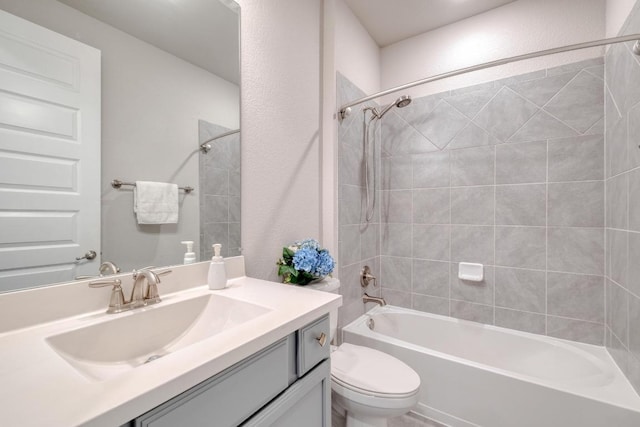 3241 Aurelia Ln, Round Rock, TX 78665 - bathroom featuring vanity, toilet, and washtub / shower combination