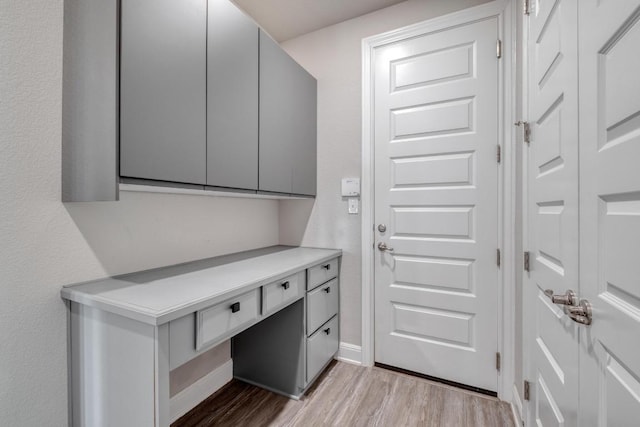 3241 Aurelia Ln, Round Rock, TX 78665 - mudroom featuring light wood-type flooring, built in study area, and baseboards