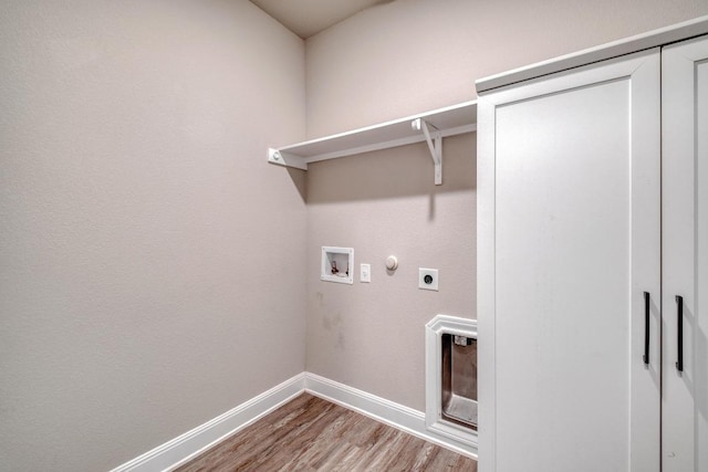 3241 Aurelia Ln, Round Rock, TX 78665 - laundry room with electric dryer hookup, baseboards, wood finished floors, washer hookup, and hookup for a gas dryer