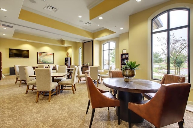 3241 Aurelia Ln, Round Rock, TX 78665 - dining area with a tray ceiling, recessed lighting, light carpet, and crown molding