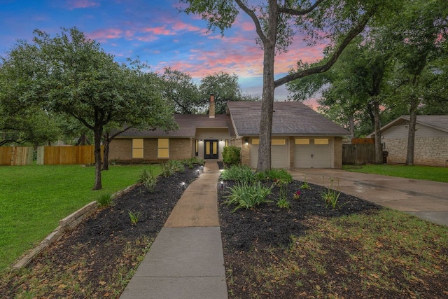 13007 Stillforest St, Austin, TX 78729 - mid-century inspired home with concrete driveway, an attached garage, a chimney, and brick siding