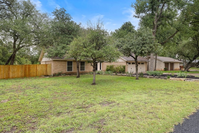 13007 Stillforest St, Austin, TX 78729 - view of front facade featuring an attached garage and brick siding