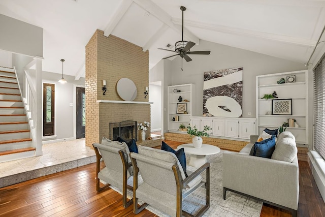 13007 Stillforest St, Austin, TX 78729 - living area with built in features, stairway, ceiling fan, high vaulted ceiling, and hardwood / wood-style floors